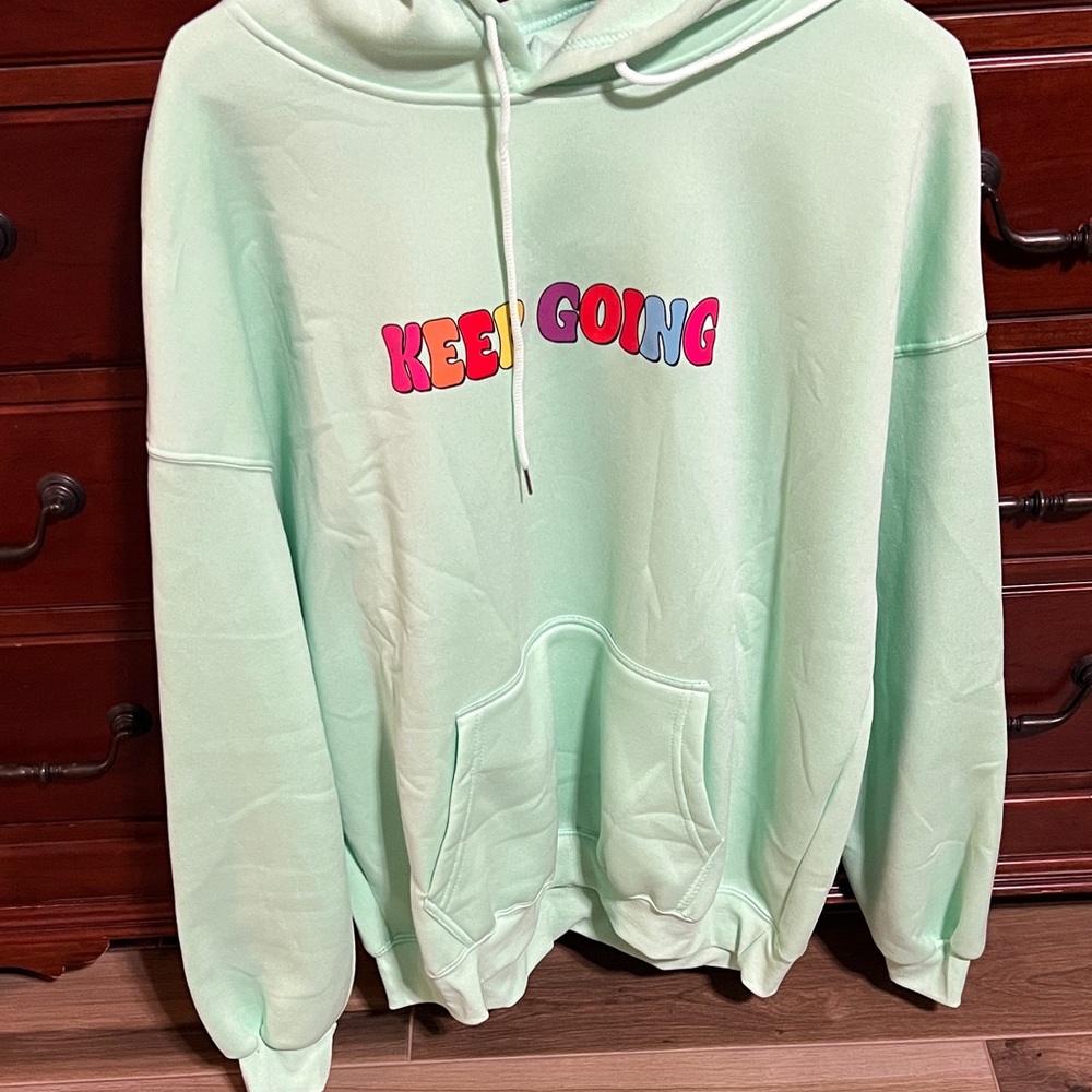 Vibrant Mint Hoodie with Motivational Print